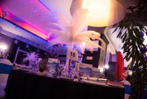 a table with a white bird on top of it at Cumberland Hotel - OCEANA COLLECTION in Bournemouth