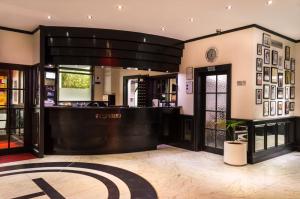 a lobby of a hotel with a reception desk at Cumberland Hotel - OCEANA COLLECTION in Bournemouth