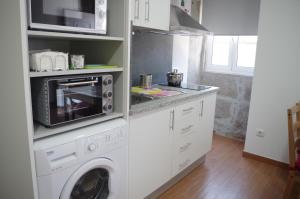 Η κουζίνα ή μικρή κουζίνα στο Casinha da Calçada +9 φωτογραφίες