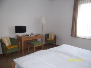 TV in/ali zabaviščno središče v nastanitvi Hotel Arcadia