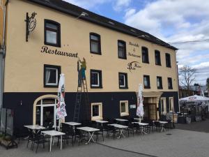 a painting of a man on the side of a building at Beim Heines in Daun