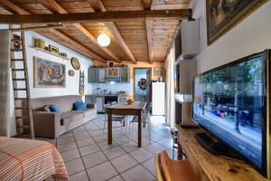 a living room with a large flat screen tv at Le Terrazze di Angela in Marina di Ragusa