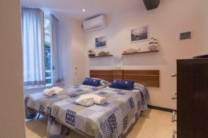 Un pat sau paturi într-o cameră la Appartamento Buranco