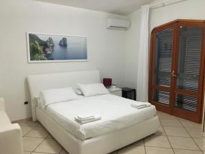 Postel nebo postele na pokoji v ubytování B&B Villa Nunzia + 37 fotografií