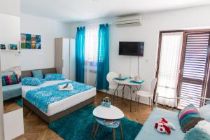 Postel nebo postele na pokoji v ubytování Apartments Stojanovic