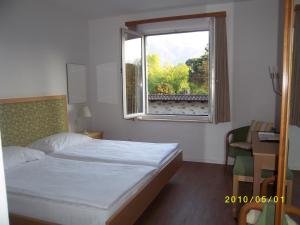 Postelja oz. postelje v sobi nastanitve Hotel Arcadia