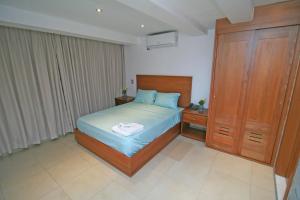 Postel nebo postele na pokoji v ubytování Palmetto Hotel