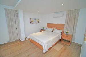 Postel nebo postele na pokoji v ubytování Palmetto Hotel