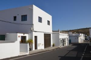 a street view of a white building at Casa la Ermita in Máguez