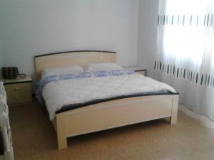 Postel nebo postele na pokoji v ubytování Residence Rotonda