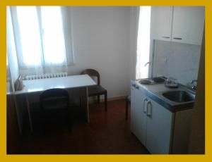 Kuchyň nebo kuchyňský kout v ubytování Residence Rotonda