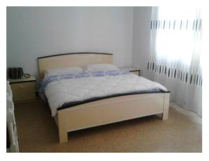 Postel nebo postele na pokoji v ubytování Residence Rotonda