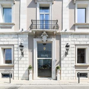 a facade of a building with a window at Grand Hotel Palace in Ancona