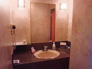 Koupelna v ubytování Hotel Sting