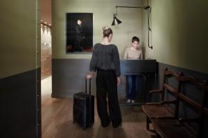 a man standing next to a woman in a room at Florentin House in Tel Aviv