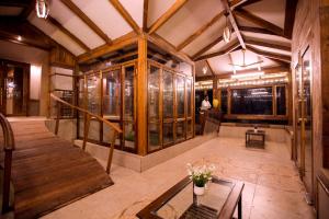 a large room with a table in a building at Kaular Atithis Grand Kokan Resort in Ganpatipule