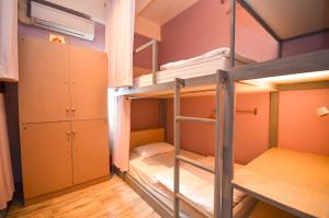 a bunk bed room with two bunk beds at Good Day Hostel in Bangkok