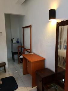 Postel nebo postele na pokoji v ubytování Unawatuna Beach Bungalow -