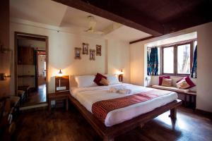 Kaular Atithis Grand Kokan Resort客房内的一张或多张床位