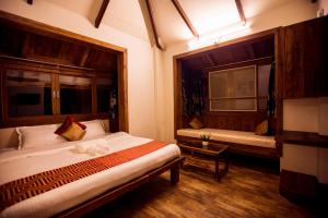 Kaular Atithis Grand Kokan Resort客房内的一张或多张床位