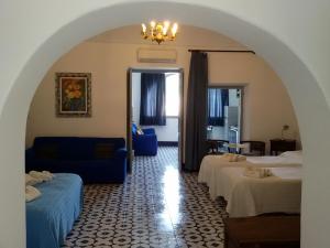 a hotel room with a bed and a mirror at Residence Acanto in Lipari