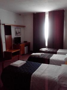 Postel nebo postele na pokoji v ubytování Hotel Niki + 37 fotografií