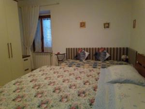 Posteľ alebo postele v izbe v ubytovaní Casa Michelangelo