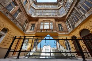 a building with a skylight and a glass door at Budget Hotel Victoria in Budapest