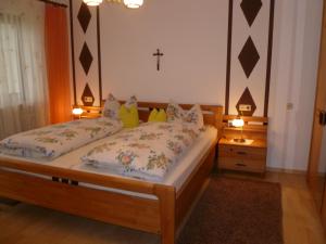 Postel nebo postele na pokoji v ubytování Haus Lissi
