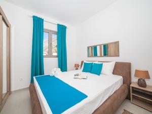 A bed or beds in a room at Apartments Castello