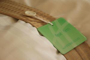 a green tag is attached to a belt at Holiday Inn Frankfurt Airport - Neu-Isenburg, an IHG Hotel in Neu Isenburg