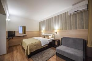 Postel nebo postele na pokoji v ubytování Hotel Požega