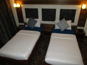 Postel nebo postele na pokoji v ubytování Hotel Sapna