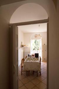 a dining room with a table in a room at Bed & Breakfast Porta Santi in Cesena