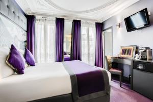 a bedroom with a large bed and a large window at Best Western Nouvel Orléans Montparnasse in Paris