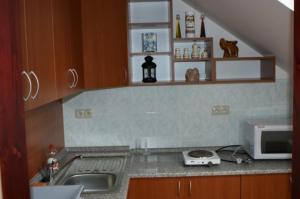 Кухня или мини-кухня в Vila Ria

