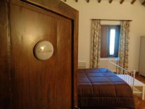 Postel nebo postele na pokoji v ubytování Agriturismo Podere Sant' Antonio