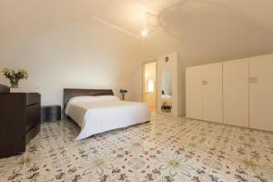 מיטה או מיטות בחדר ב-San Martino
