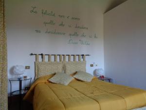 Postel nebo postele na pokoji v ubytování Agriturismo Podere Sant' Antonio