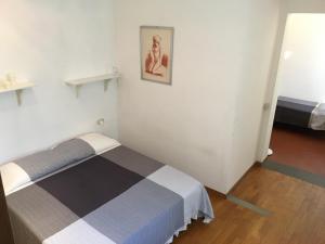 
A bed or beds in a room at Appartamento Lorena
