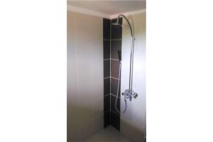 a shower in a bathroom with a glass door at Prostor Guest House in Byala +98 photos