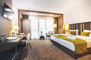 Katil atau katil-katil dalam bilik di Caramell Premium Resort Superior