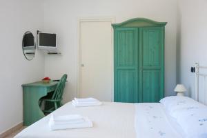 Postel nebo postele na pokoji v ubytování Il Melograno