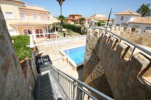 a villa with a swimming pool and a house at Villa Sonnenschein in Els Poblets
