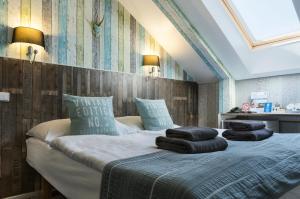 Posteľ alebo postele v izbe v ubytovaní Royal Court Hotel