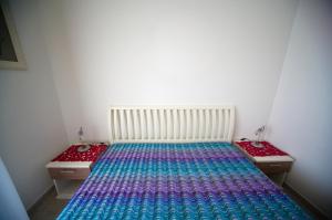 A bed or beds in a room at LE NOBILI DIMORE - appartamenti a Gallipoli