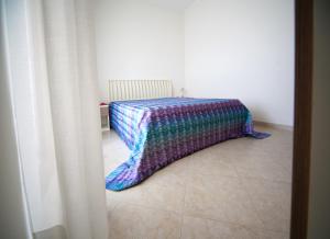 A bed or beds in a room at LE NOBILI DIMORE - appartamenti a Gallipoli