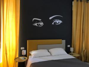 A bed or beds in a room at Sensation House