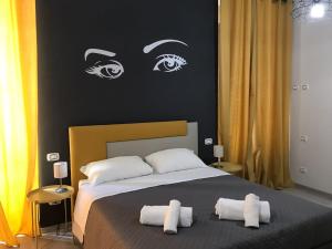 A bed or beds in a room at Sensation House
