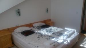 Cama ou camas em um quarto em Guest House Garbevi